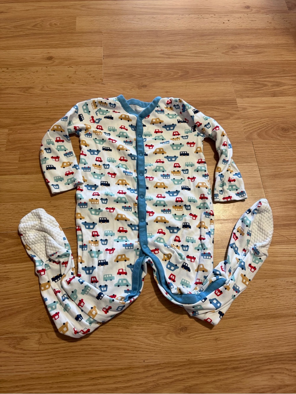 Baby Footed One-Piece Sleeper in White with Blue Trim and Car Print